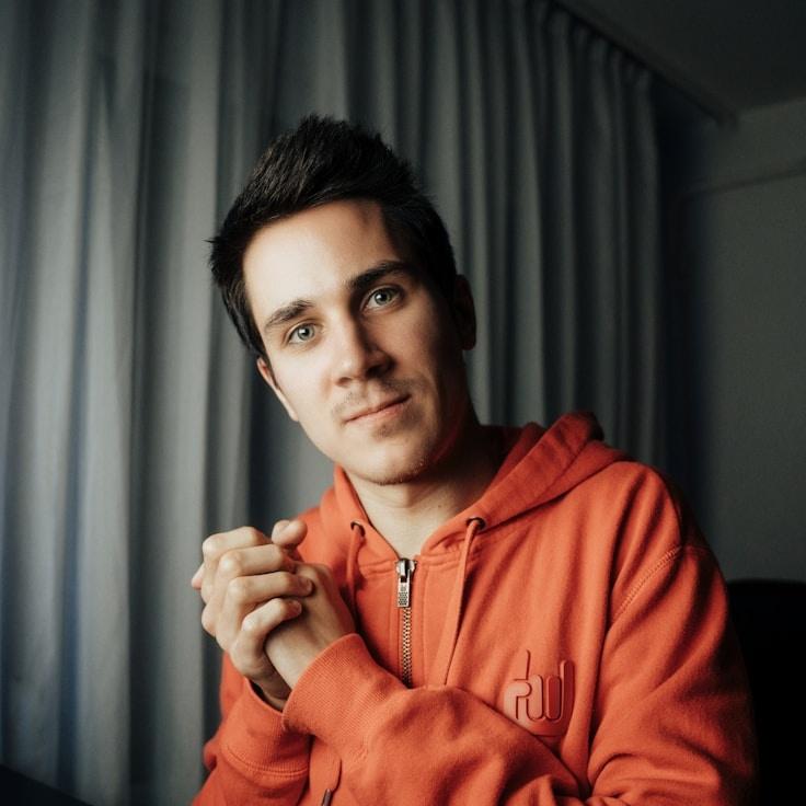 Avery Rao, Lead Design Curator at Universal Workflow Matrix, reviewing corporate floral arrangements